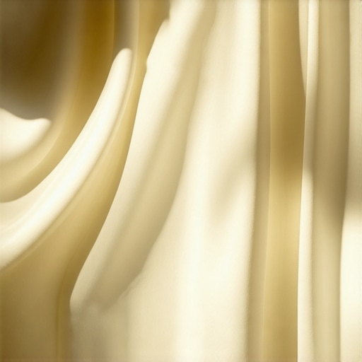 Close-up of soft, shiny silk fabric showing delicate texture.